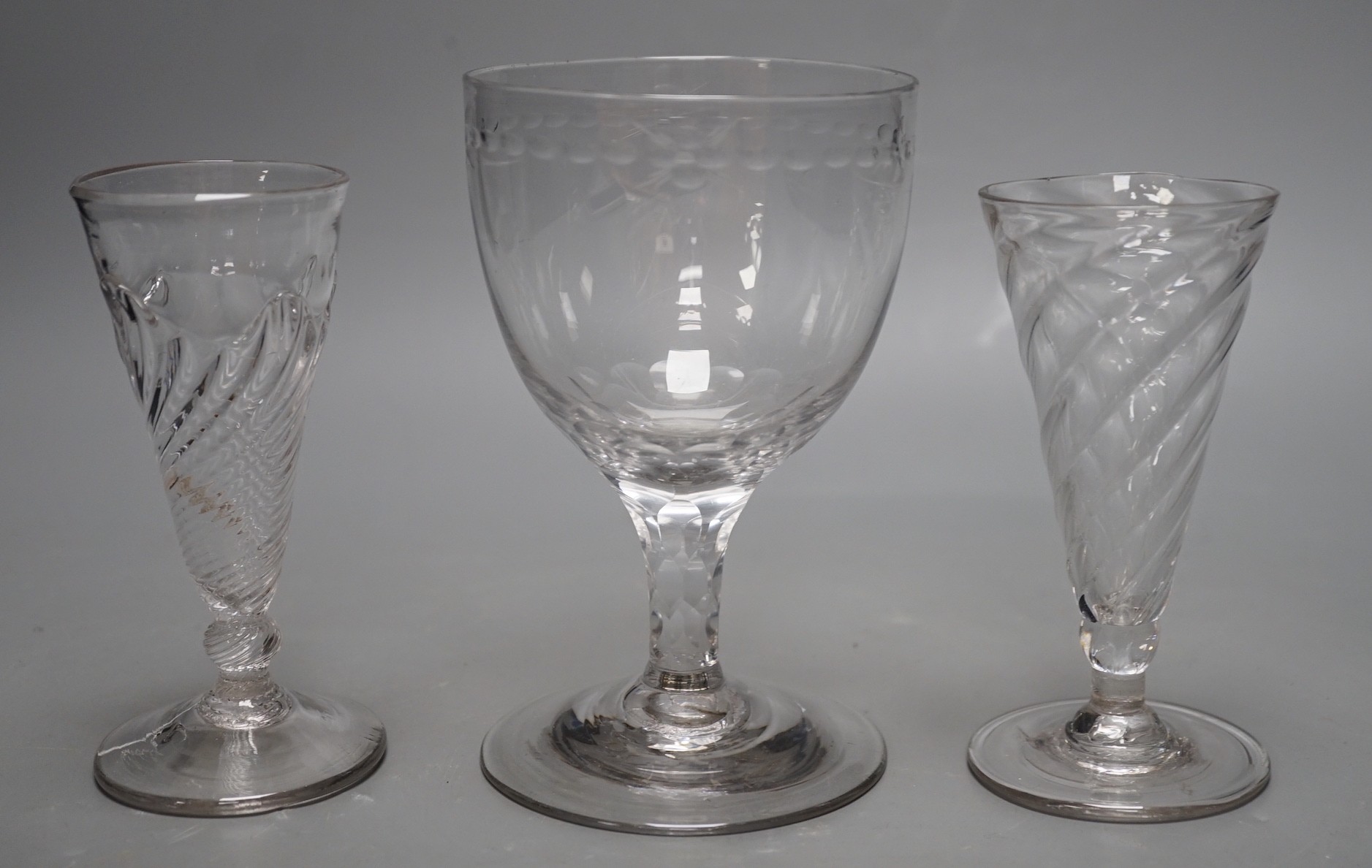 Two wrythen ale flutes, 18th century and a facet stem ‘OXO’ glass rummer, tallest 15cms high